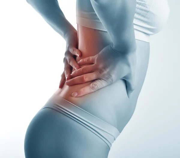 Young girl with pain in a waist — Stock Photo, Image