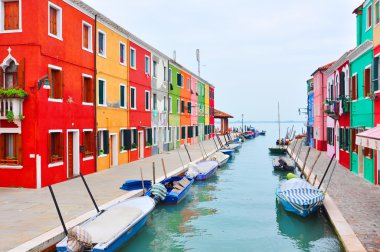 Venice landmark, Burano island canal, colorful houses church and boats, Italy. clipart