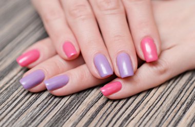 Bright stylish manicure with colored nail polish clipart