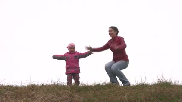 Mother with child play on meadow — Stock Video