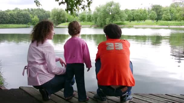 Family on pond — Stock Video