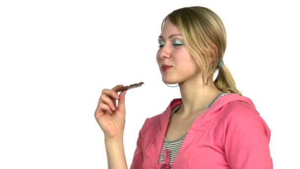 Woman eats chocolate — Stock Video