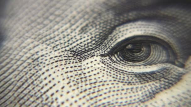 Eye macro on dollar bill, rotating — Stock Video