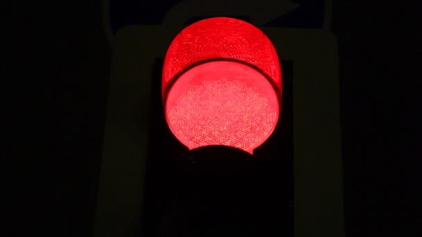 Pedestrian traffic light showing red in the night — Stock Video