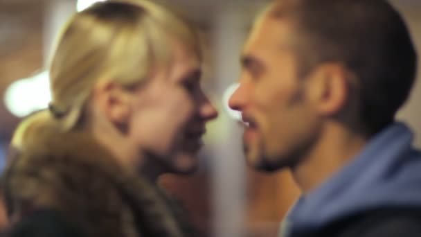 Conversation man with woman, standing together on city lights background — Stock Video