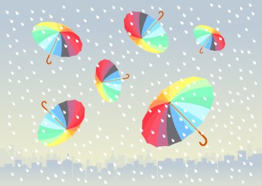 Beş renkli şemsiyeler altında büyük şehre uçuyor. yağmur yağıyor.