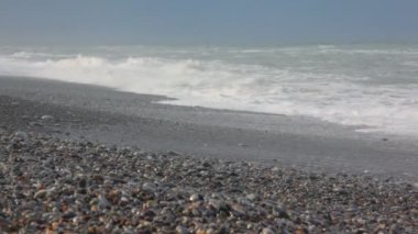 nature scene in rocky coast, sea surf waves and sky