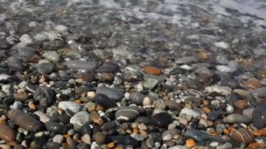 Deniz pebble kıyısı, makro çekim kapsayan hoş ile sörf