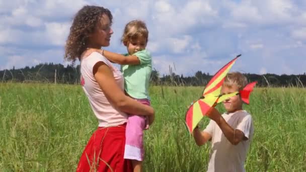 Boy showing airplane to his mother and sister — Stock Video