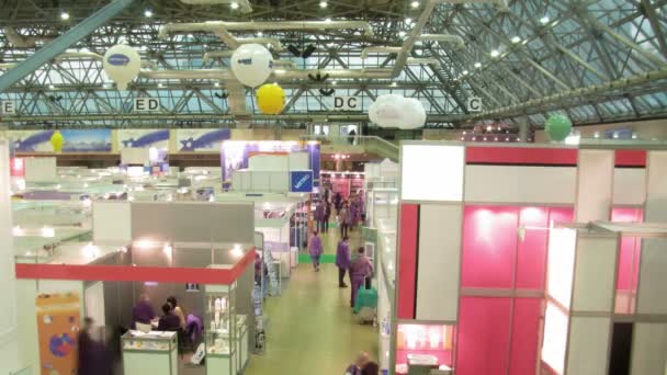 In exhibition centre approach to stands to receive the information, the top view — Stock Video