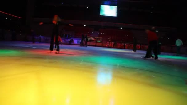 Camera moving in skating rink with illumination past — Stock Video