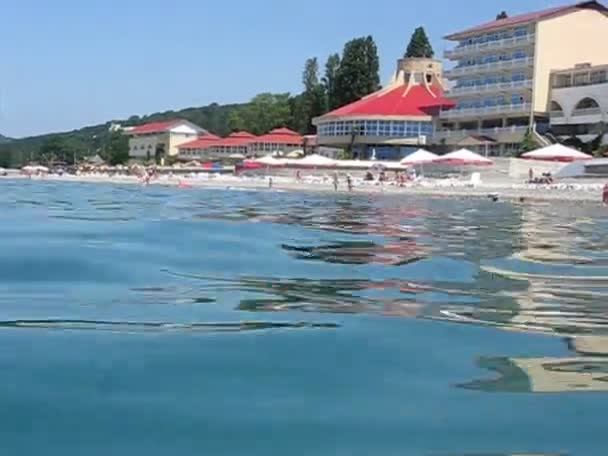 View of hotel from sea near beach — Stock Video