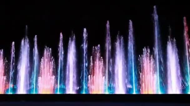 Fountains with different illumination in circus of dancing fountains — Stock Video