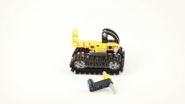 The toy bulldozer have disassembled and have collected from details. — Stock Video