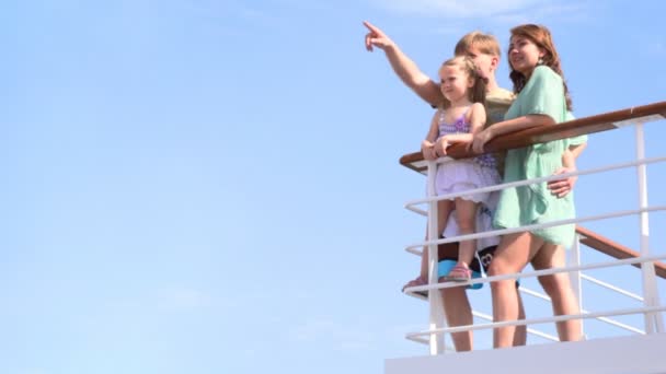 Family is standing at railing on deck — Stock Video