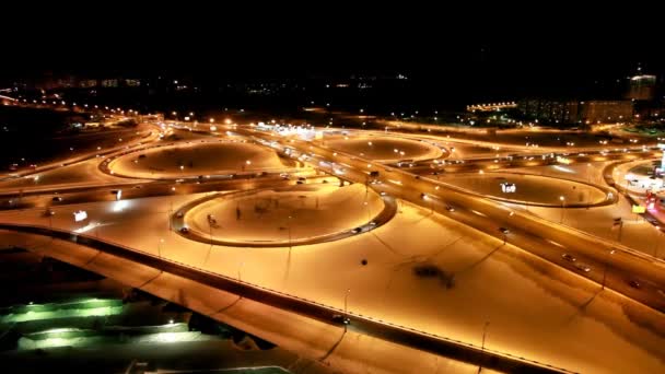 Movement around a crossroads on winter highway in the night — Stock Video