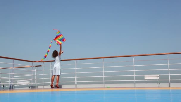 General view on woman flying kite on deck — Stock Video