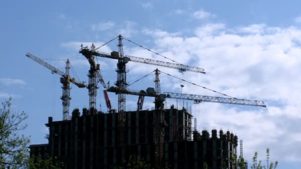 Under construction houses and cranes against sky in Moscow, Russia. — Stock Video