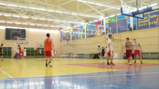 Young men play basketball in Russian State University — Stock Video