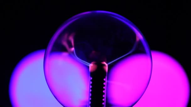 Close-up shot of plasma ball with blue and pink blots — Stock Video
