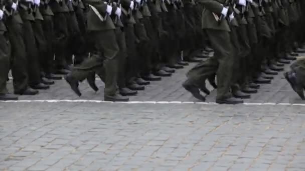 Legs soldiers march in rows on pavement at military parade — Stock Video