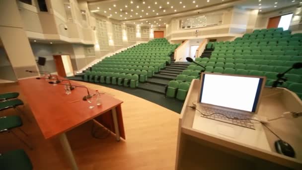 View from stage of empty conference hall with seats — Stock Video