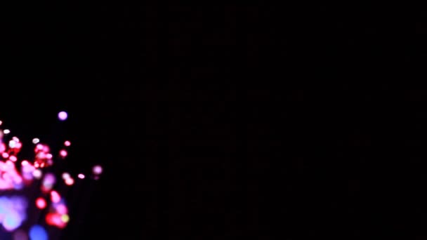 Closeup of flicker lights move on black — Stock Video