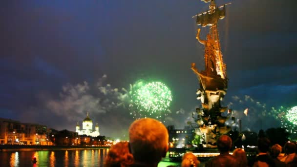 People watch bright fireworks — Stock Video