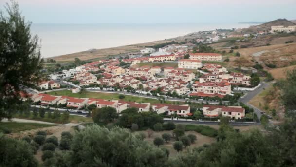 View from hill of costal village, sea and hills has shown — Stock Video