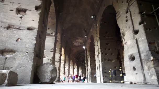 Colosseum corridor inside, tourists walk along — Stock Video