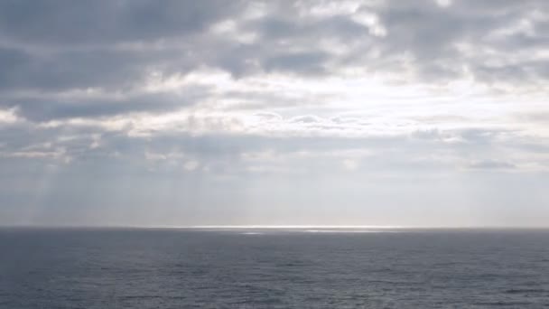 Light pass through clouds at sea, time lapse — Stock Video