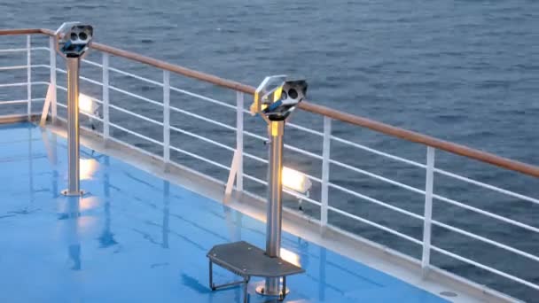 Binoculars on deck of cruise liner in evening time, time lapse — Stock Video