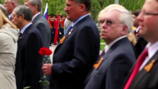 President Dmitriy Medvedev stand near military man, official establishment walk with flowers — Stock Video