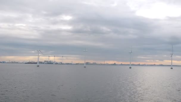 Pass by wind farm in Copenhagen harbor, view from ship deck — Stock Video