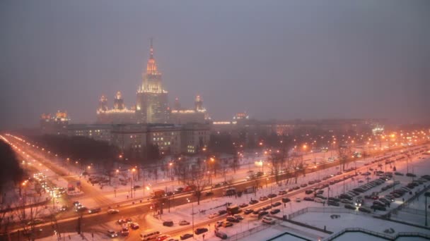 Main building of Moscow State University at winter night — Stock Video