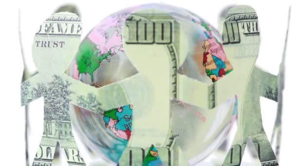Paper dollars people stand holding hands and rotates around globe — Stock Video