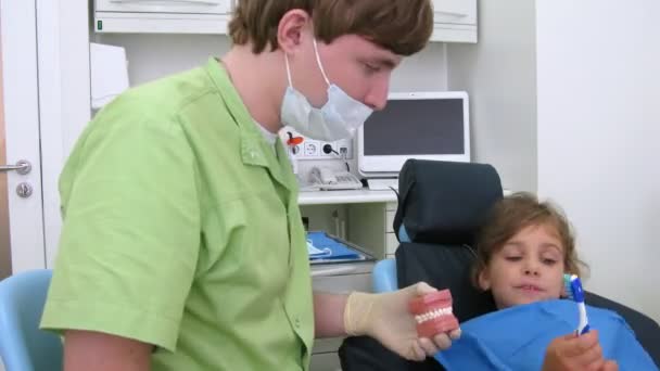 Brave girl in dental clinic chair, time lapse — Stock Video