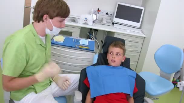 Boy having mouth check-up in dental clinic, time lapse — Stock Video