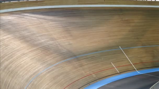 Group of bicyclists participates in competitions on bicycle track in sports complex — Stock Video