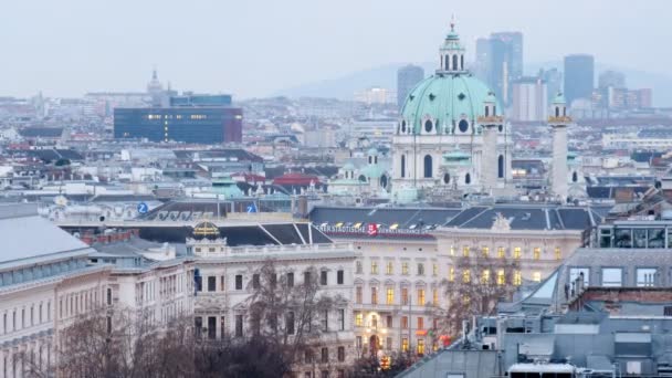 Domes of Karlskirche Church extend upward above city landscape — Stock Video