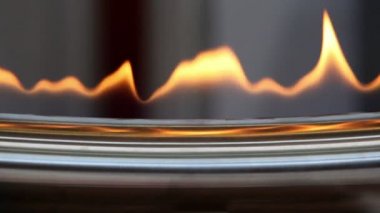 Tongues of flame at edge of metal plate