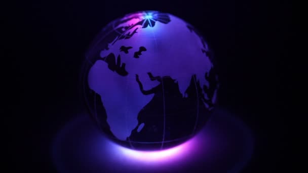 Glass Earth sphere with color illumination — Stock Video