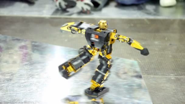 Toy robot dance on metal surface — Stock Video