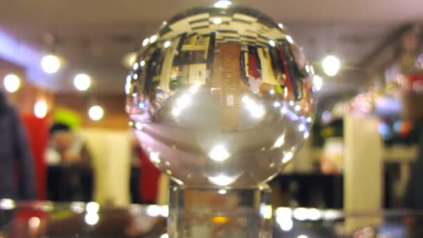 New Year cafe is reflected in transparent ball — Stock Video