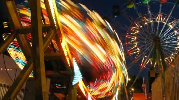 Carousel Disko and Observation wheel are fly round in park — Stock Video