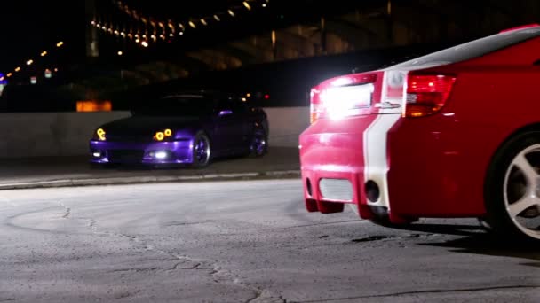 Few car with colorful sport design ride backward lit — Stock Video