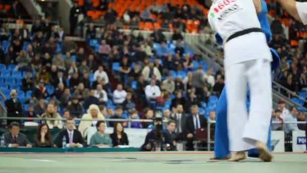 Sportsmen Zivic from Russia in dark blue and Mirco in white kimono fight at World Cup 2011 KUDO — Stock Video