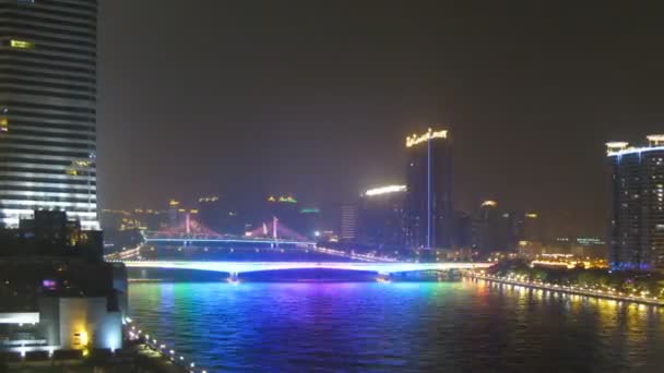 Jiangwan bridge and Haiyin Bridge stands in front of skyscrapers near to floating boats — Stock Video