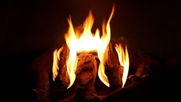 Artificial Campfire With Firewood Burns In Dark Fireplace Stock