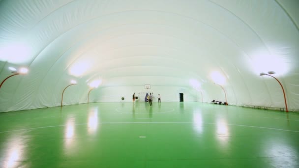 Four students play soccer, upward motion — Stock Video